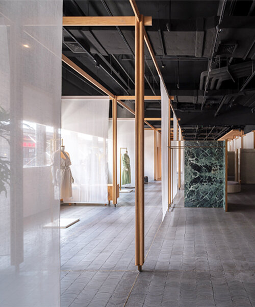 neri&hu weaves green marble, brass & linen screens into Ms MIN's retail space in shanghai