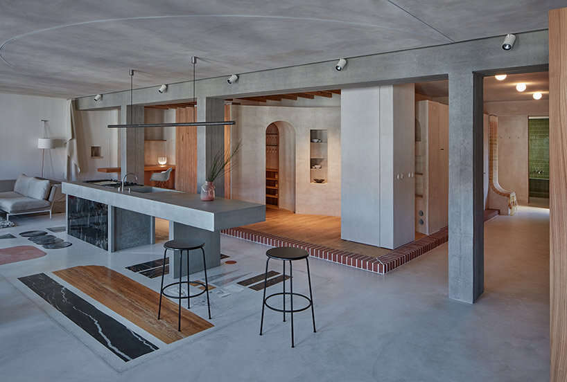 open-plan apartment in prague integrates hidden niches, arches & intricate patterns