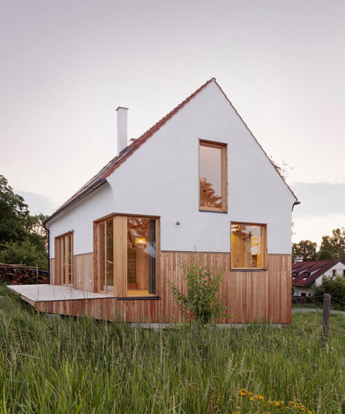 terracotta gable roof tops martin zizka's organic house, echoing czech republic's landscape