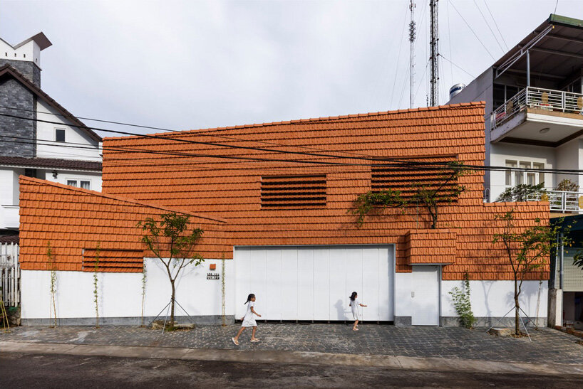 the bloom architects' tile-wrapped house regulates vietnam's tropical and temperate climate