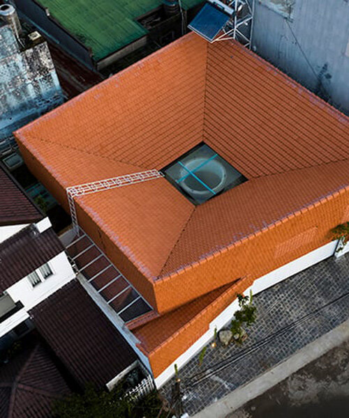 the bloom architects' tile-wrapped house regulates vietnam's tropical and temperate climate
