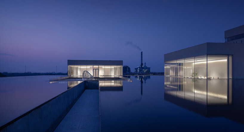 biomanufacturing facility by xing design lies under shallow water ponds in china