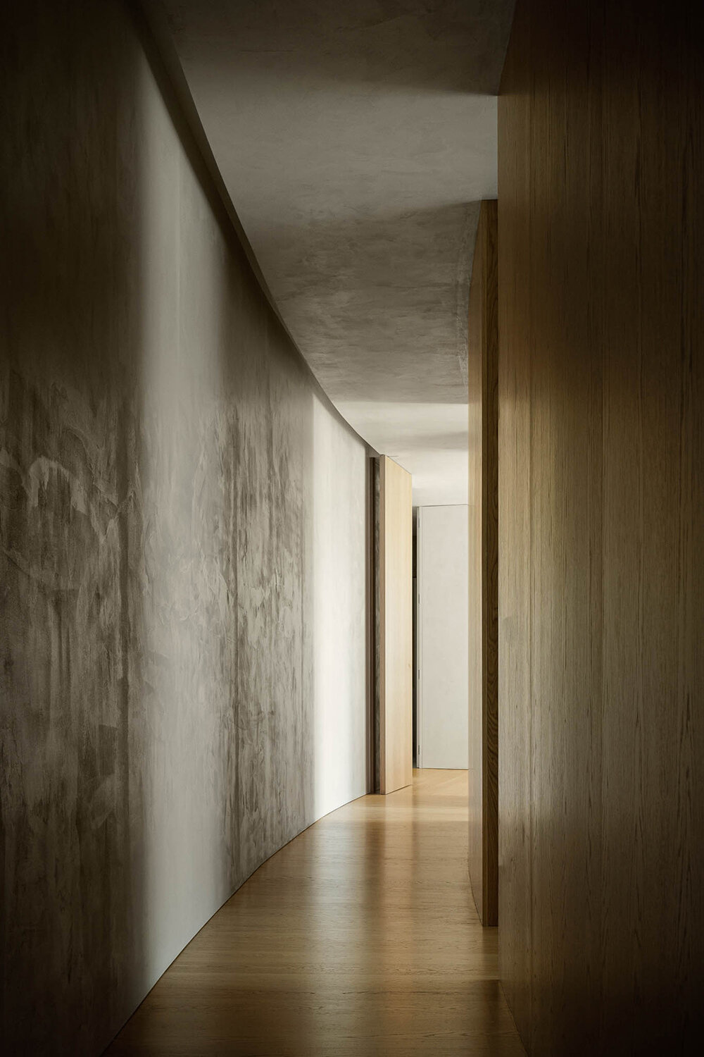 set like a bending body, mutant's casa de bouro seemingly hugs the portuguese landscape