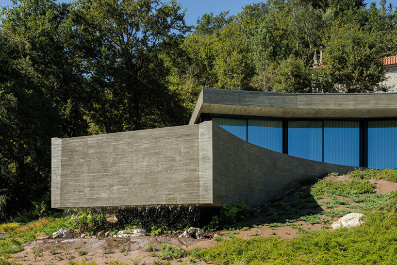 set like a bending body, mutant's casa de bouro seemingly hugs the portuguese landscape