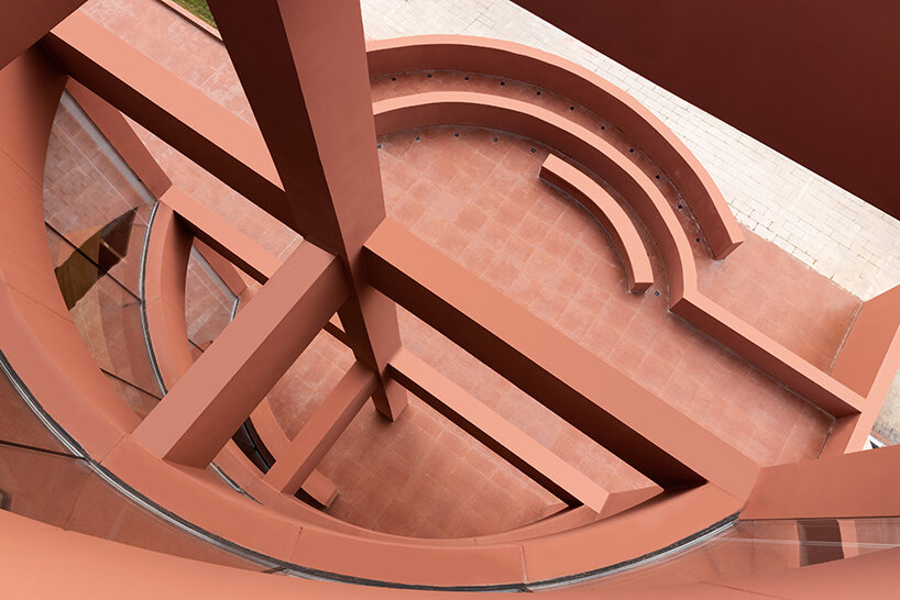 li city study invites 24/7 reading amid a terracotta-hued & skylit backdrop in china