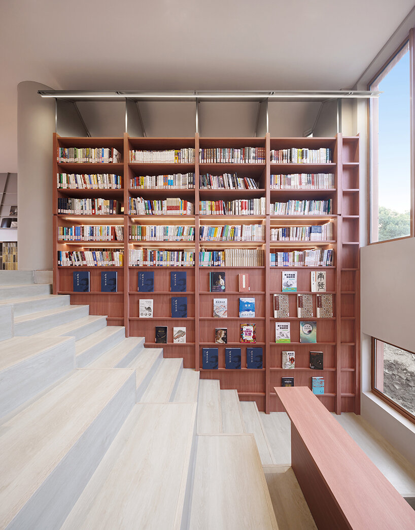 li city study invites 24/7 reading amid a terracotta-hued & skylit backdrop in china