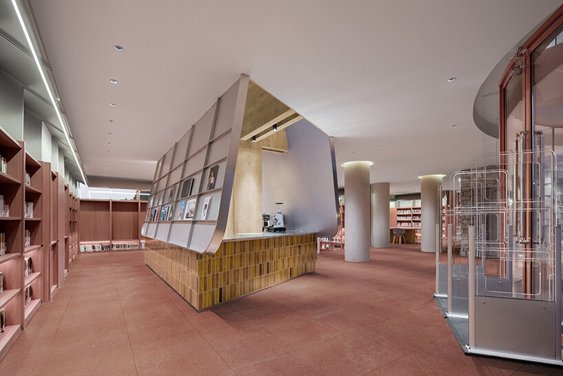 li city study invites 24/7 reading amid a terracotta-hued & skylit backdrop in china