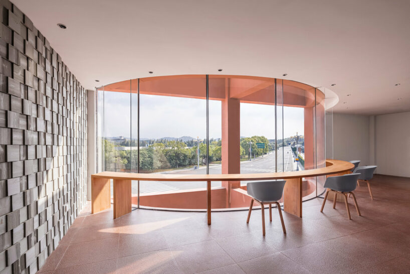 li city study invites 24/7 reading amid a terracotta-hued & skylit backdrop in china