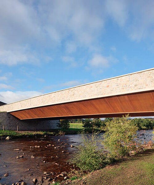 moxon's new granite and steel bridge in rural scotland stands alongside historic crossing