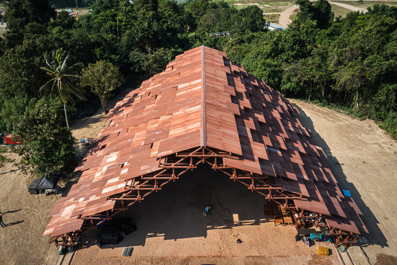 bangkok project studio constructs grand gable roof pavilion for thailand's festival