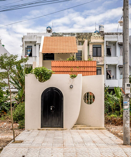 da vàng studio nurtures seven gardens within its nhà voi house in vietnam