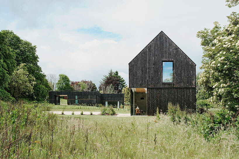 loader monteith architects nestles a base for cyclists in a scottish meadow