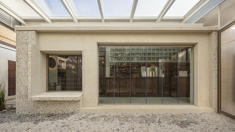 korean studio one-aftr repurposes industrial ruins into plant-filled dabang café
