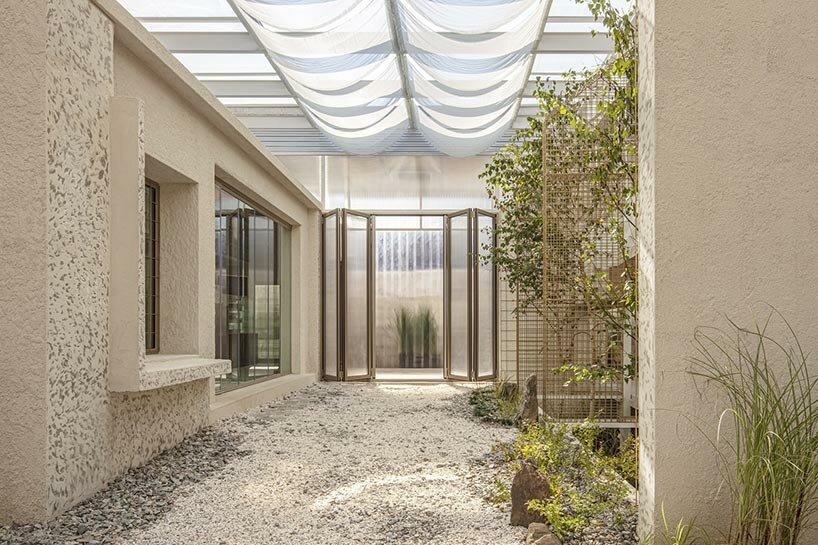 korean studio one-aftr repurposes industrial ruins into plant-filled dabang café