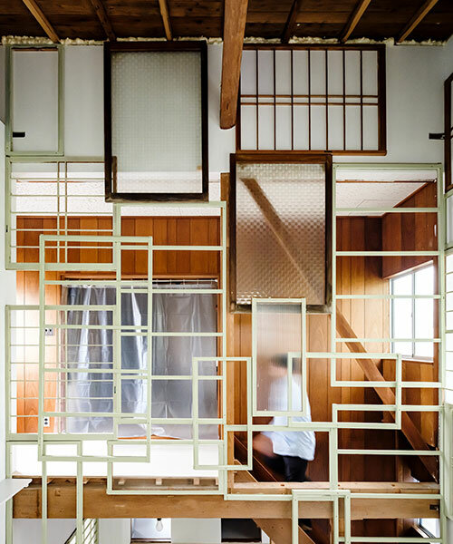 repurposed window frames in green pastel add a splash of brightness to OTA's house in japan