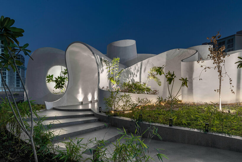 the grid architects' pravaah workspace in india curves and flows around native flora