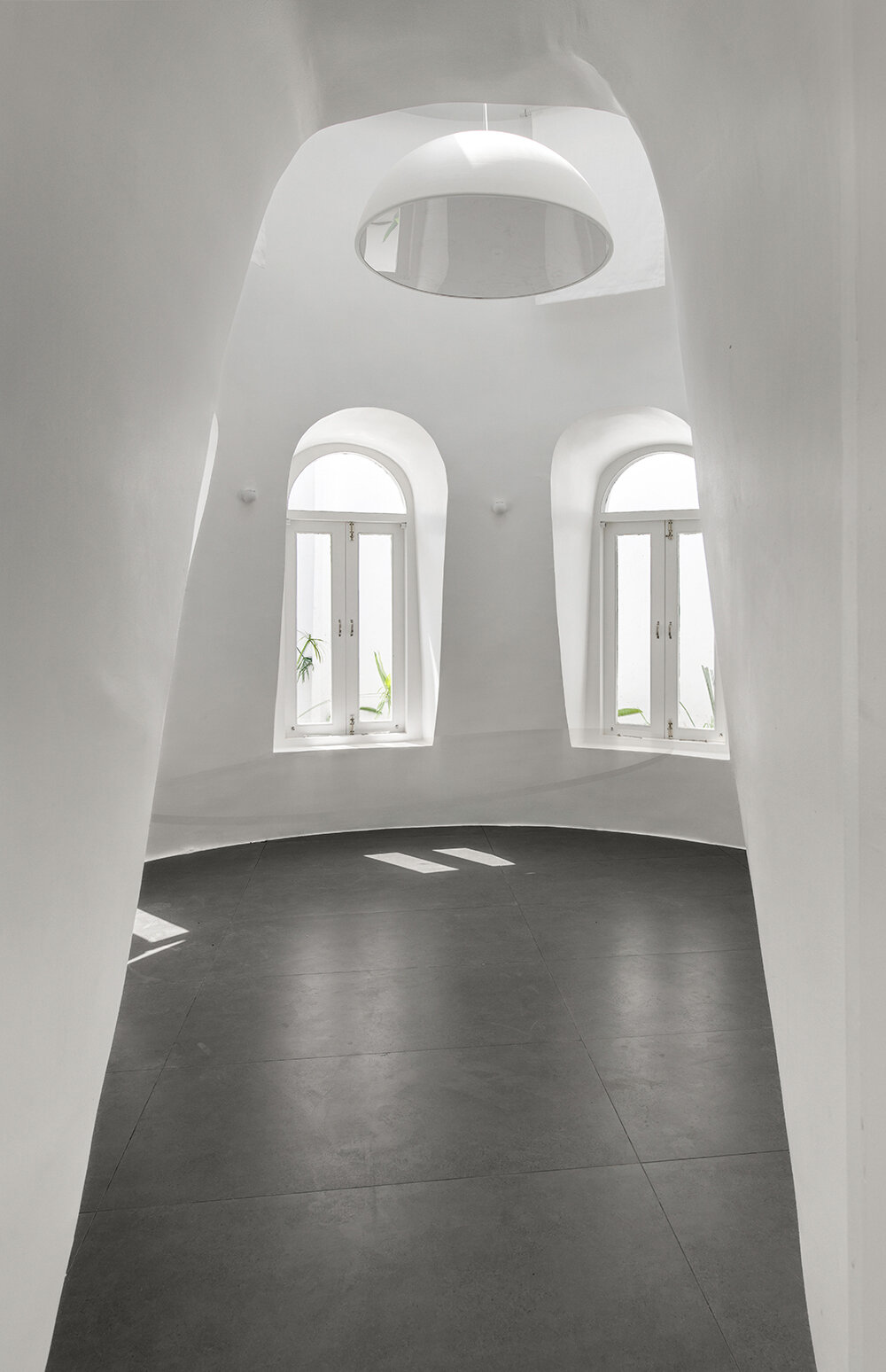 the grid architects' pravaah workspace in india curves and flows around native flora