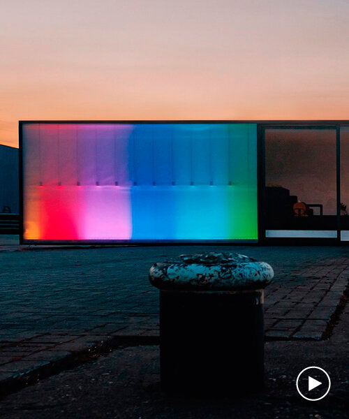 rainbow LED display illuminates the exterior of compact box studio in belgium