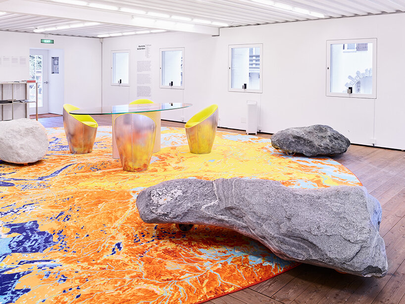 studio other spaces weaves vibrant rugs and boulders into das gelbe haus films for latest exhibition