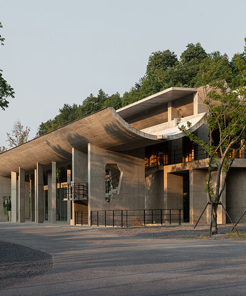 imposing inverted arches top studio zhu pei's international conference camp in china