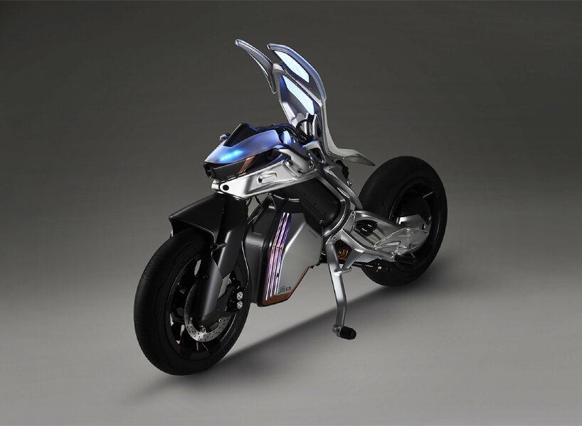 futuristic yamaha MOTOROiD2 balances and parks itself by pulling the  kickstands on its own