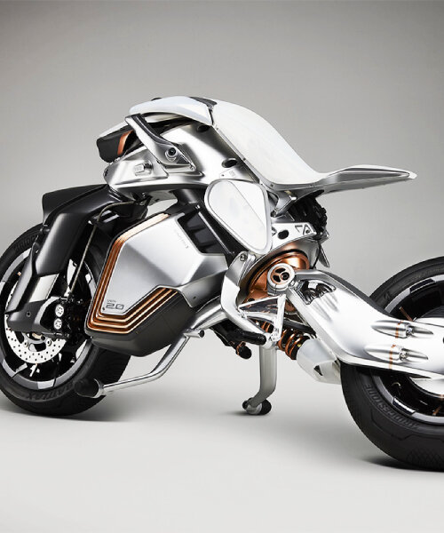 futuristic yamaha MOTOROiD2 balances and parks itself by pulling the kickstands on its own