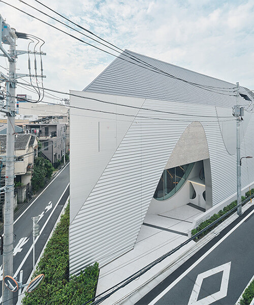 organic openings cut angular learning center in tokyo