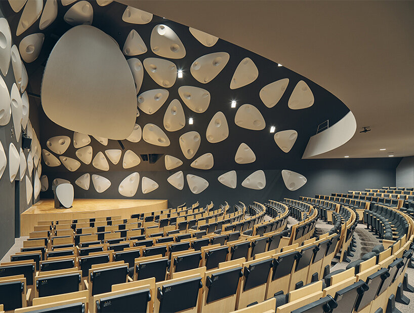 organic openings cut angular learning center in tokyo 