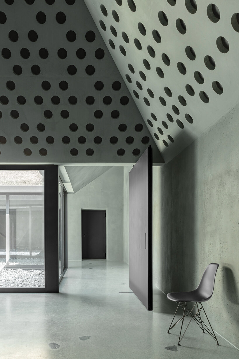 pedevilla inserts inner courtyards & dome-like skylights into workplace renovation in italy