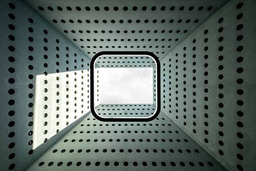 pedevilla inserts inner courtyards & dome-like skylights into workplace renovation in italy