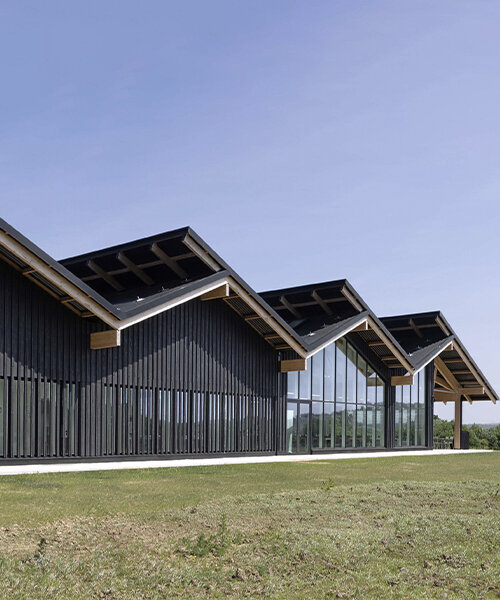 coldefy envelops double-sloped hermès factory in ardennes with burnt wood cladding