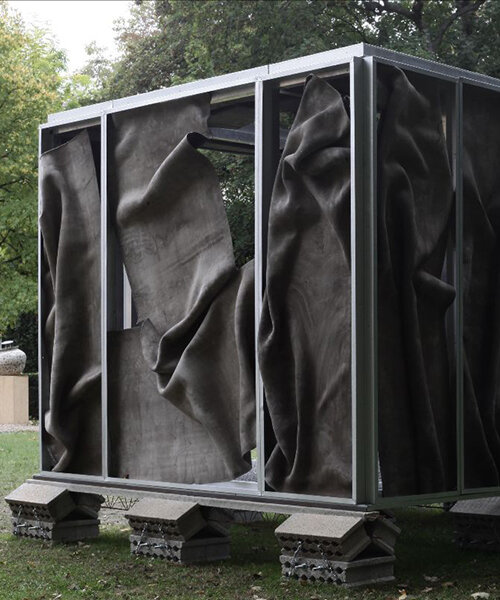 crumpled cement drapes over function-free pavilion X in paris