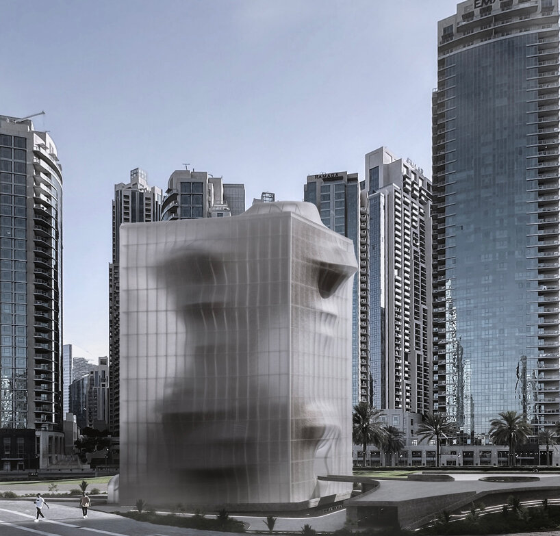semi-transparent membrane wraps the sculptural body of dubai art museum