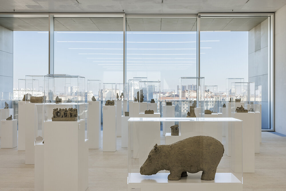 157 raw clay sculptures by fischli/weiss land at fondazione prada