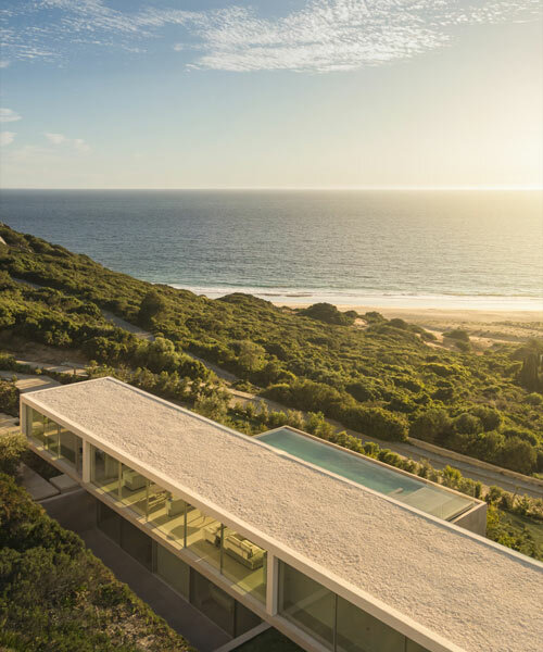 fran silvestre perches this 'house on the air' along the rugged coast of southern spain