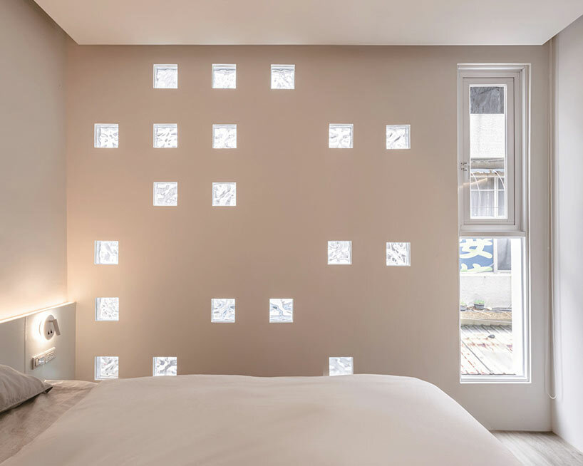 speckled windows illuminate TYarchistudio's renovated 'house OO' in taiwan