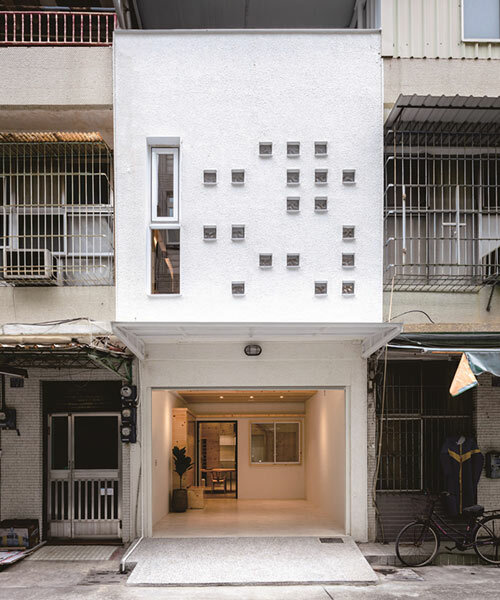 speckled windows illuminate TYarchistudio's renovated 'house OO' in taiwan