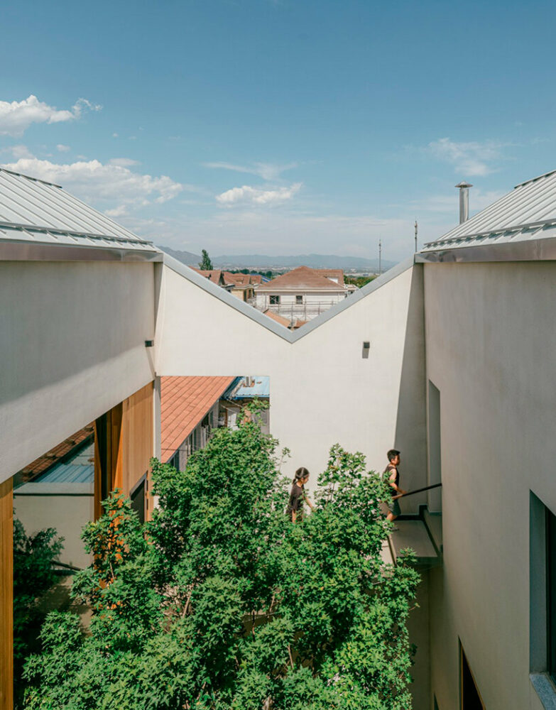 residence by chaoffice unfolds an array of staggered sequences on sloping plot in beijing