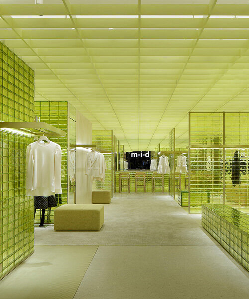 yellow glass bricks and louvers shape curiosity's labyrinthine concept store in osaka