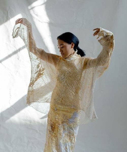 dasha tsapenko grows biodegradable wedding dress from mycelium & vintage ukrainian lace