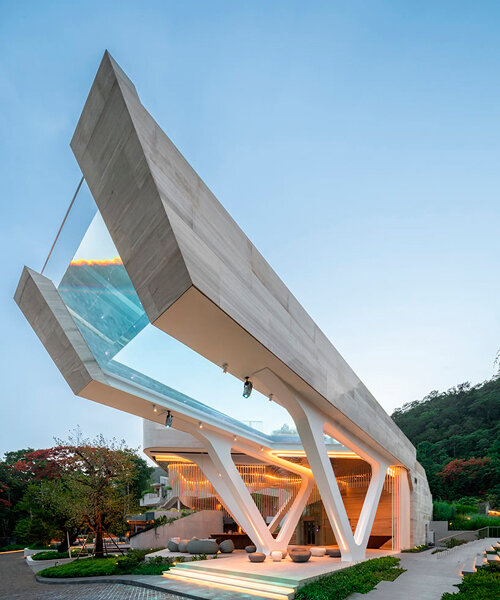 cantilevered transparent pool hovers above hotel complex in thailand
