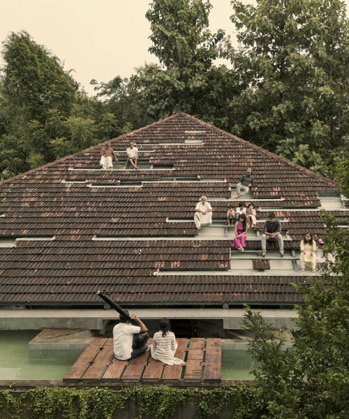 a tiled rooftop amphitheater encloses wallmakers' nisarga art hub in india