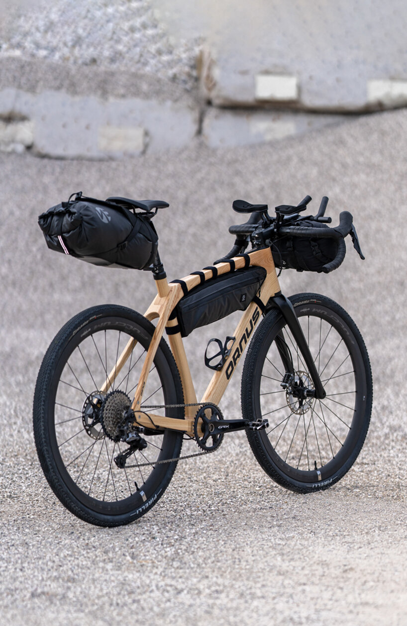 crafted from laminated ash wood layers, ornus bike absorbs vibrations for a smoother ride