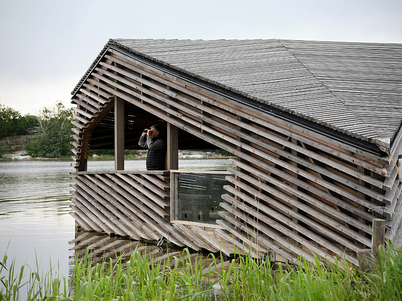 for timber floating finland hut puisto studio birdwatchers designs in