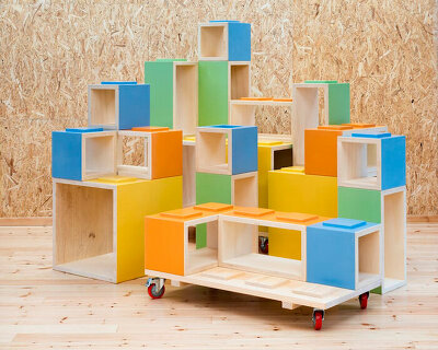 modular furniture pieces assemble to form varying play scenarios within lisbon-based school