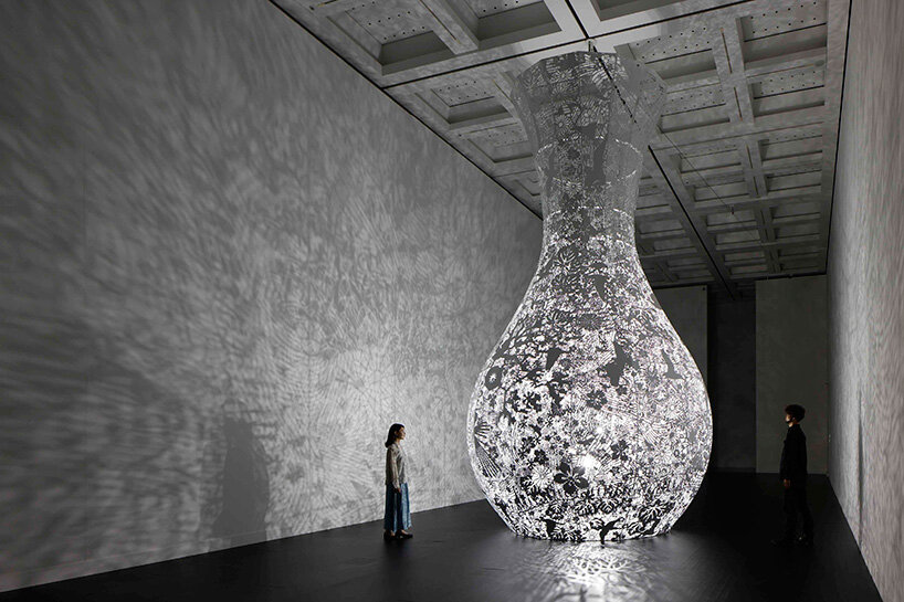shinji ohmaki's delicately carved vessels cast shadows of flowers at national art center, tokyo