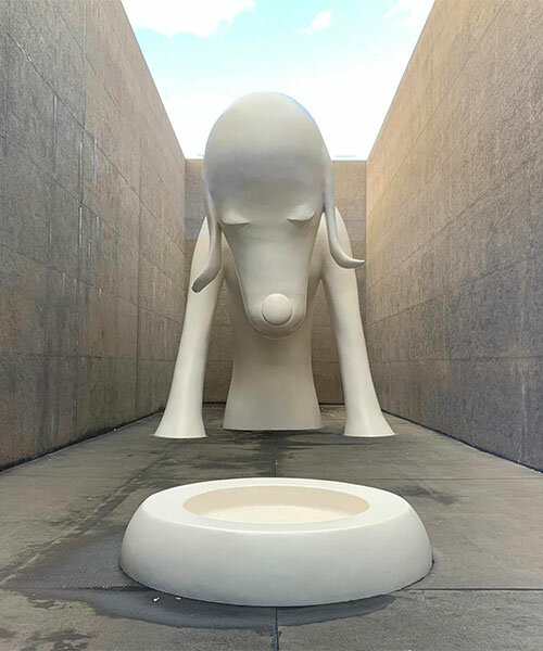 colossal dog sculpture welcomes visitors to yoshitomo nara's solo exhibition in aomori, japan