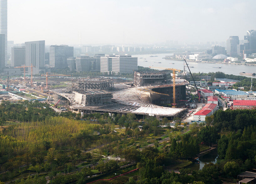 snøhetta shares construction progress of spiraling grand opera house in shanghai