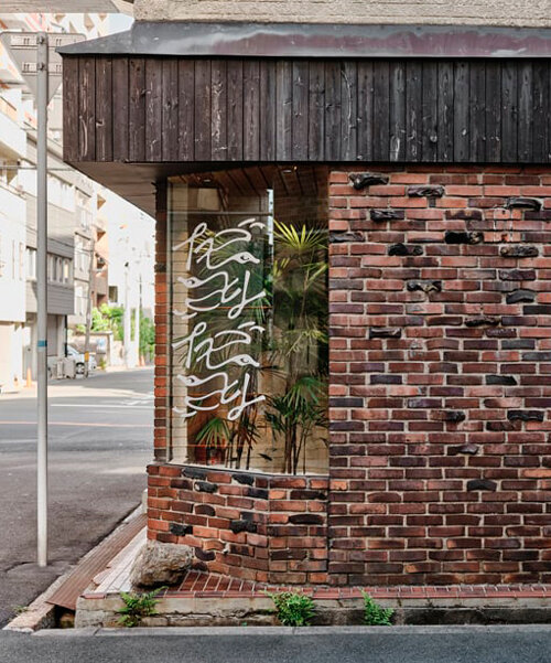 renovated restaurant by stod preserves its historic brick frame in japan