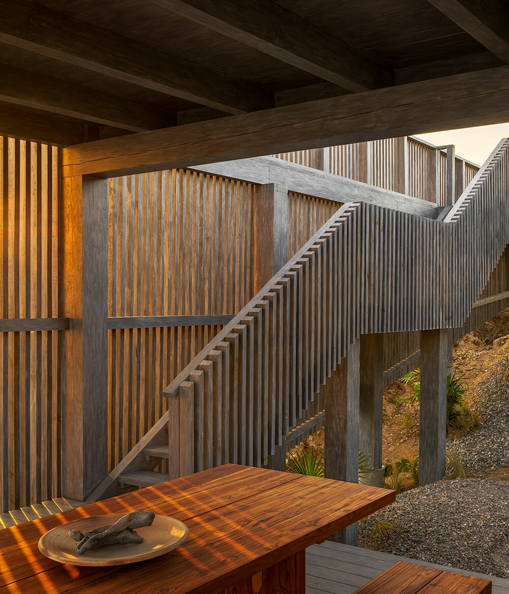 UAVI pavilion by PPAA is an ephemeral wooden haven rising above mexico's sandy shores